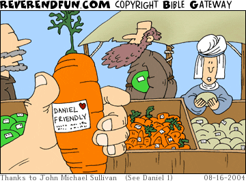 DESCRIPTION: Hand holding carrot with a label on it CAPTION: 